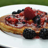 Pancake with berries and maple syrop